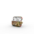A decorative protective case for an AirPods charging case, featuring a vintage playing card design with a gold suit, red hearts, and green patterns, shown with white AirPods inside on a clean white background.